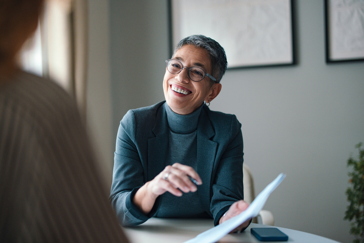 Tax professional meeting with a client to discuss their Australian tax return. Tax professional meeting with a client to discuss their Australian tax return.