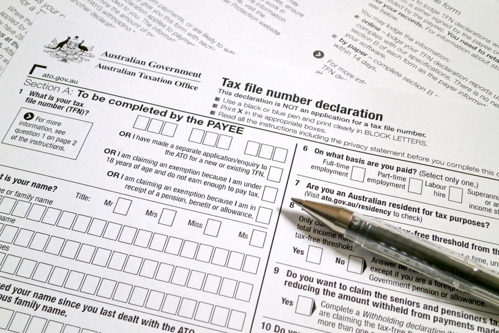 Australian Taxation Office Tax File Number declaration form with a pen ready for completion.