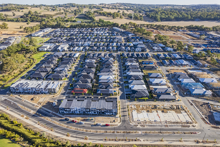 Aerial view of Australian housing development illustrating investment property and capital gains tax on real estate